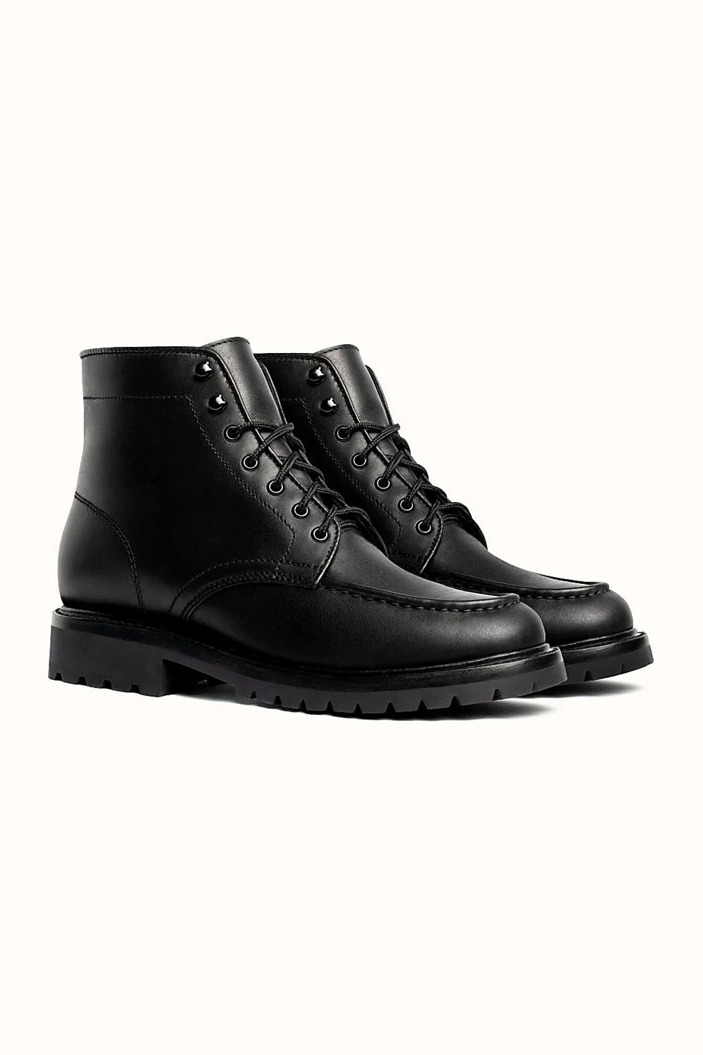 Black full-grain moc toe boot with lug outsole