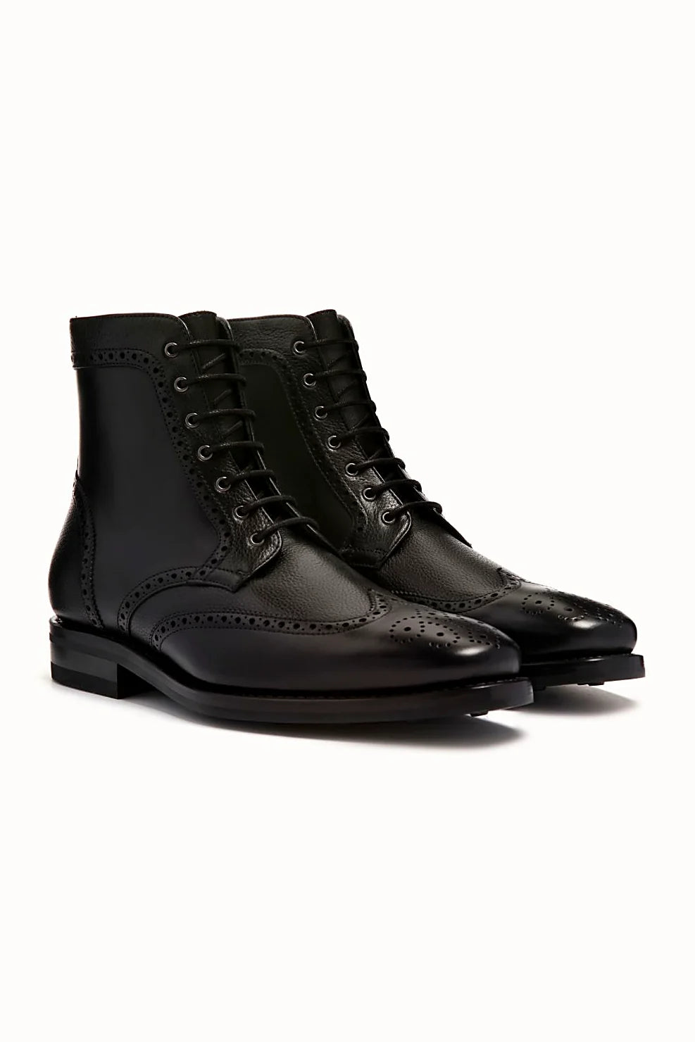 Black brogue boot in smooth and pebbled leathers