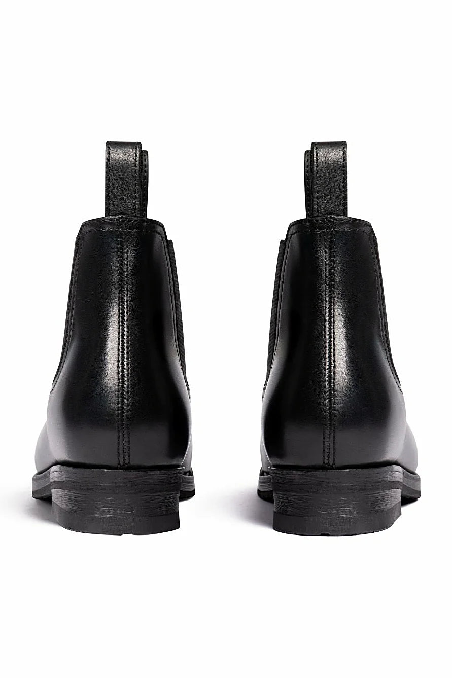 Hand-finished black boot with pull tabs